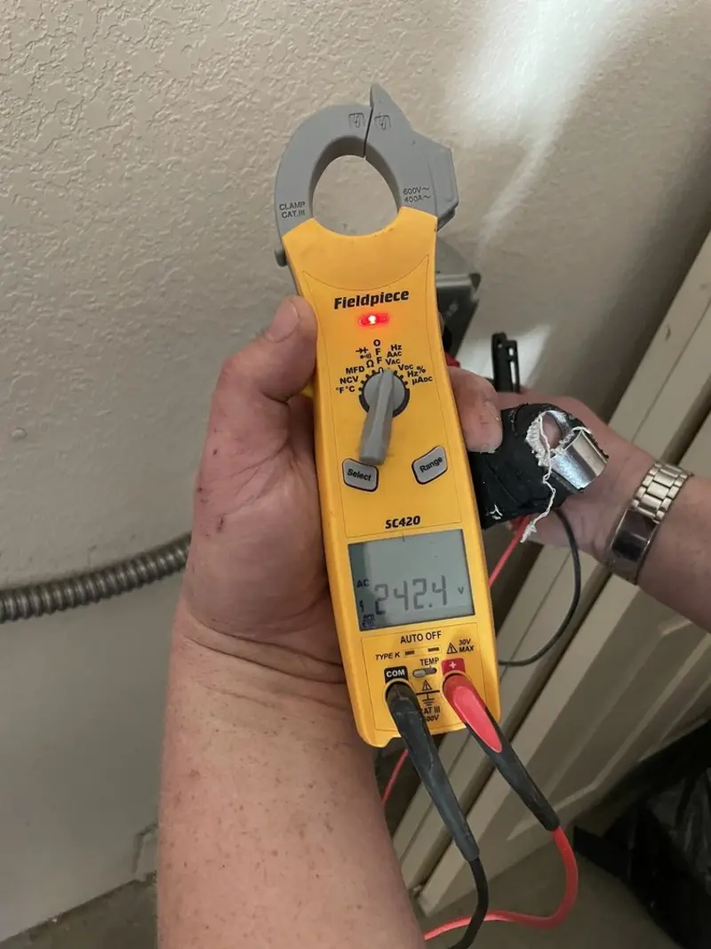Voltage testing with clamp meter during Whole House Surge Protector in Crestview Hills